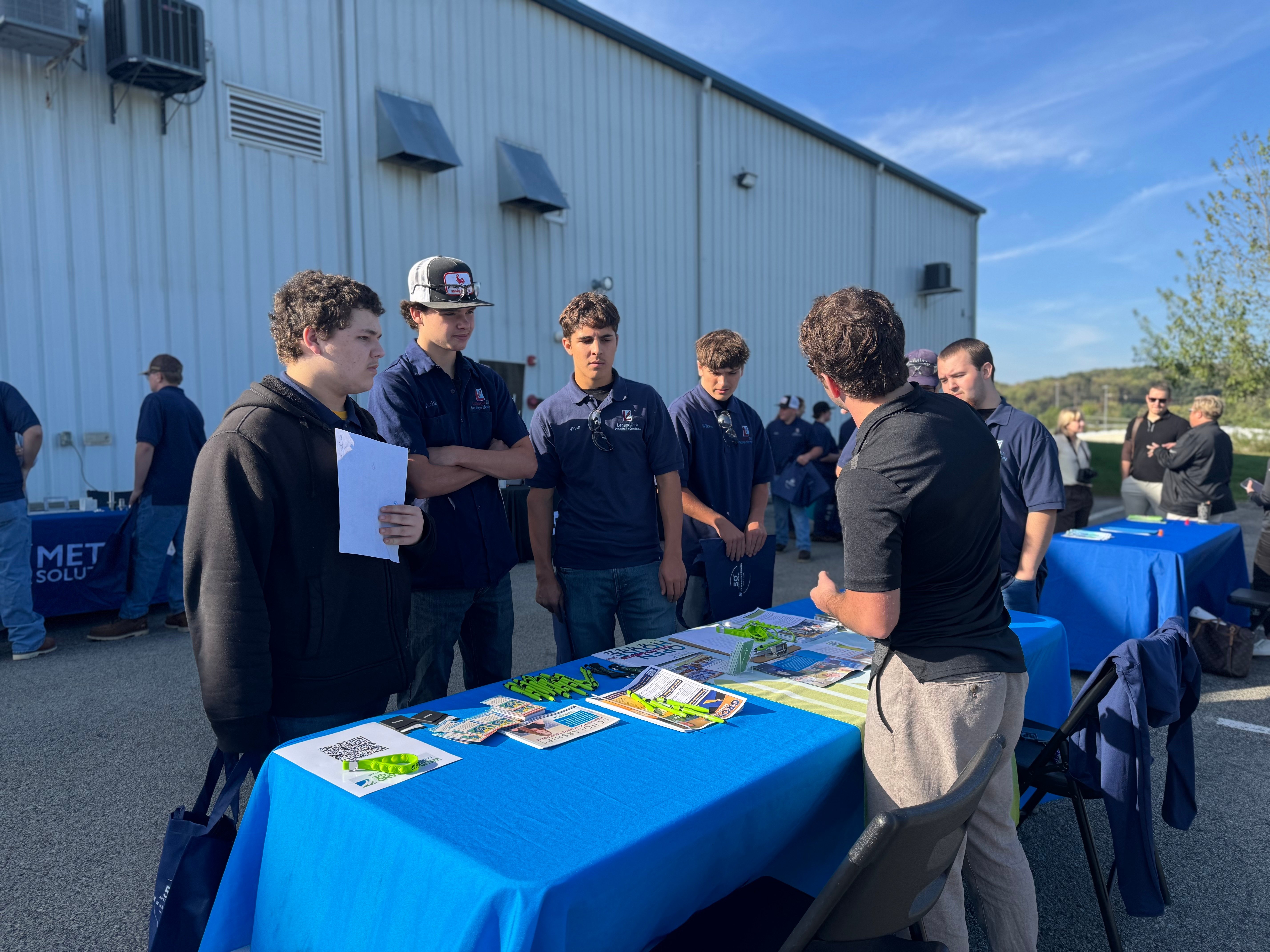 students learning from JV team on MFG day 