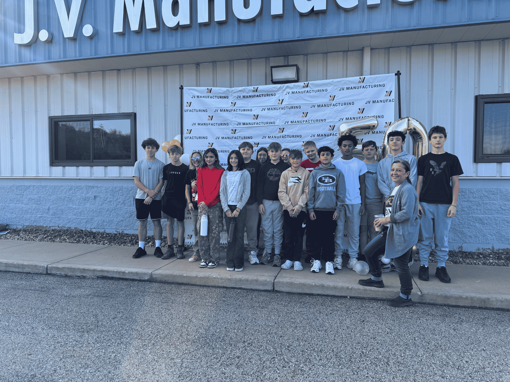 MFG Day team photo outside building